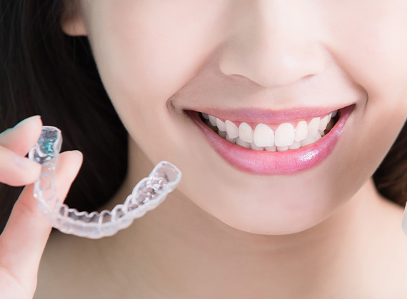 woman's smile with clear aligner